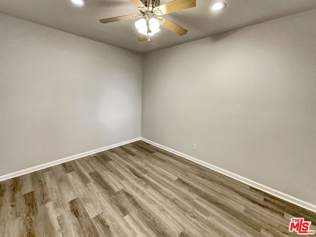 unfurnished room featuring ceiling fan and hardwood / wood-style floors