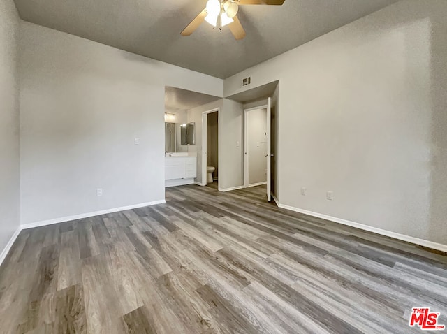 unfurnished room with ceiling fan and hardwood / wood-style floors