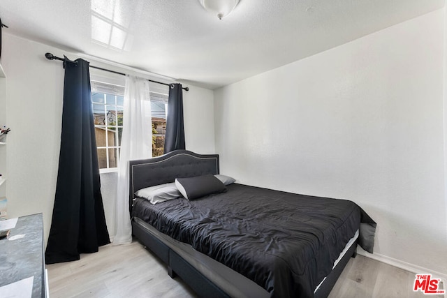 bedroom featuring light wood-type flooring