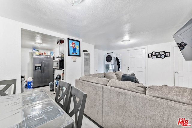 living room with a textured ceiling