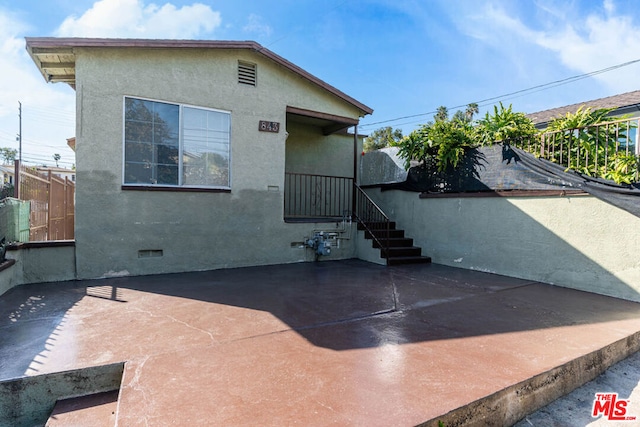 back of property with a patio area