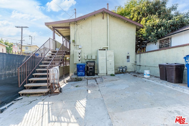 back of property with a patio area