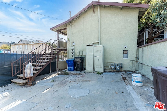 view of side of property with a patio area