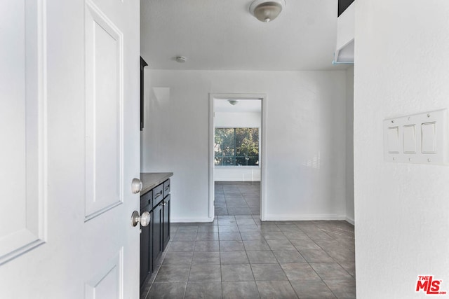 interior space with dark tile patterned floors