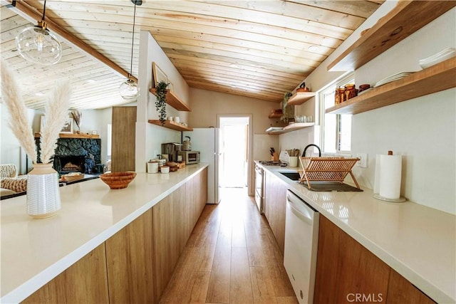 kitchen with wood ceiling, hanging light fixtures, white appliances, a fireplace, and light hardwood / wood-style floors