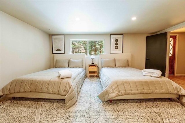 bedroom featuring wood-type flooring