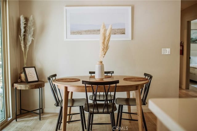 dining area with light hardwood / wood-style flooring