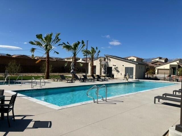 view of swimming pool with a patio area