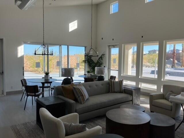 living room with high vaulted ceiling