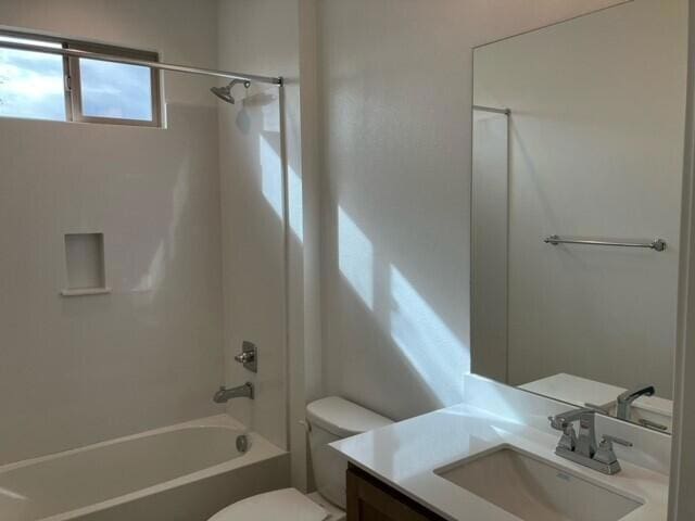 full bathroom with shower / tub combination, vanity, and toilet