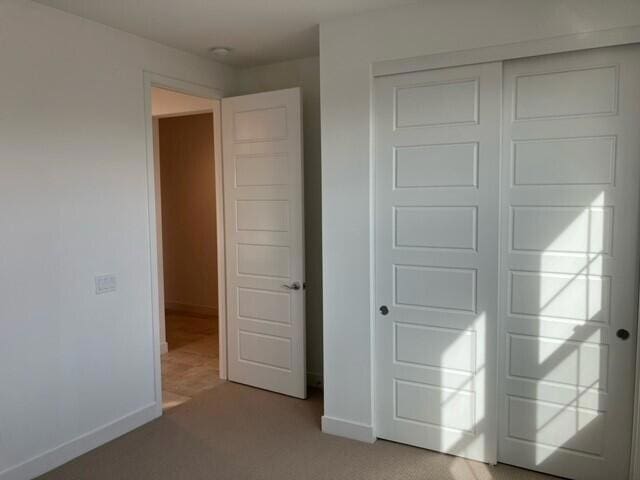 unfurnished bedroom featuring a closet