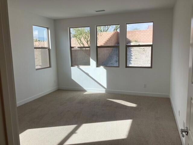 empty room featuring dark carpet