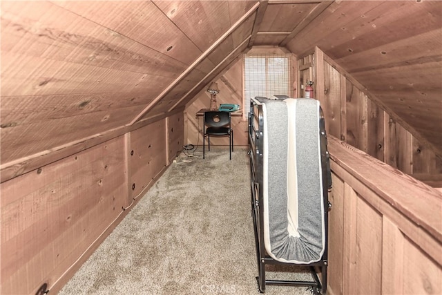 additional living space with wood walls, vaulted ceiling, light carpet, and wooden ceiling