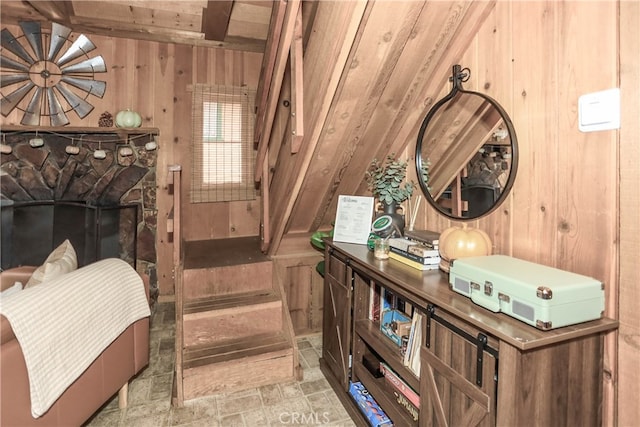 interior space featuring wood walls and beam ceiling