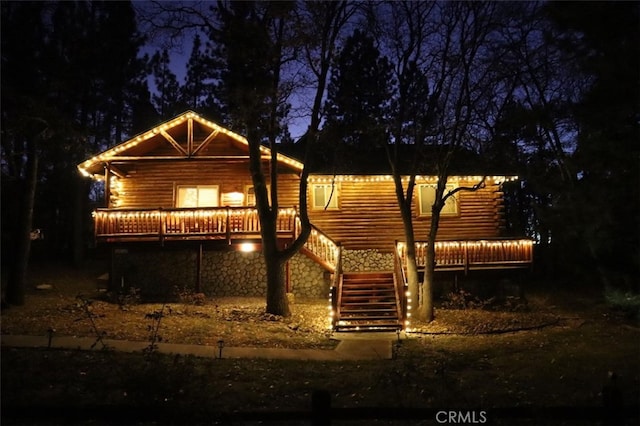 back of house at twilight with stairs