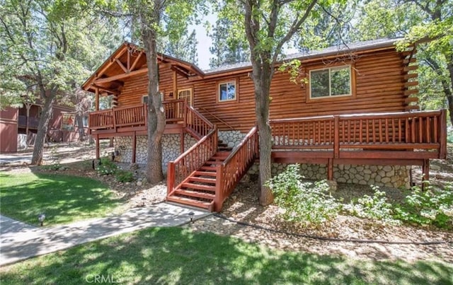 back of house featuring a wooden deck