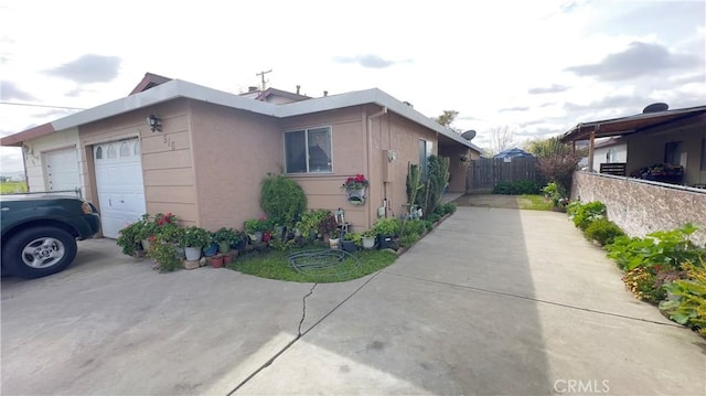 view of side of home featuring a garage