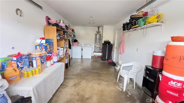 garage with independent washer and dryer and gas water heater