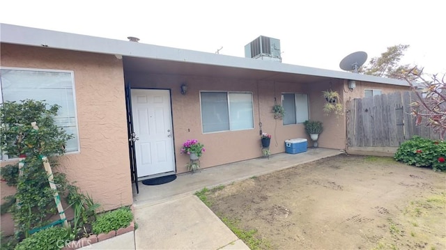 doorway to property featuring central AC