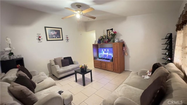 tiled living room with ceiling fan