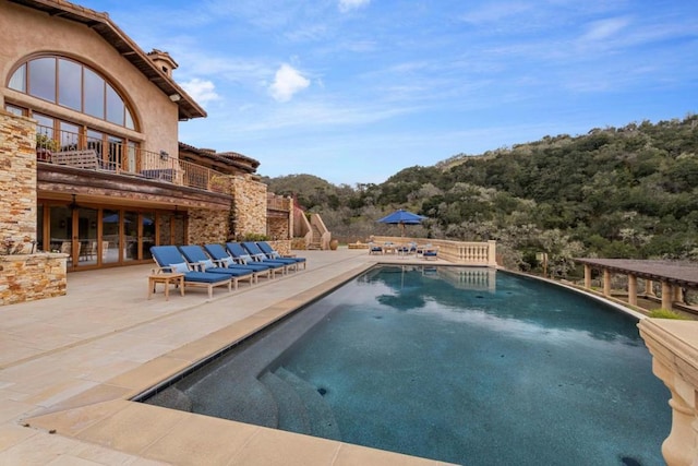 view of swimming pool featuring outdoor lounge area and a patio area