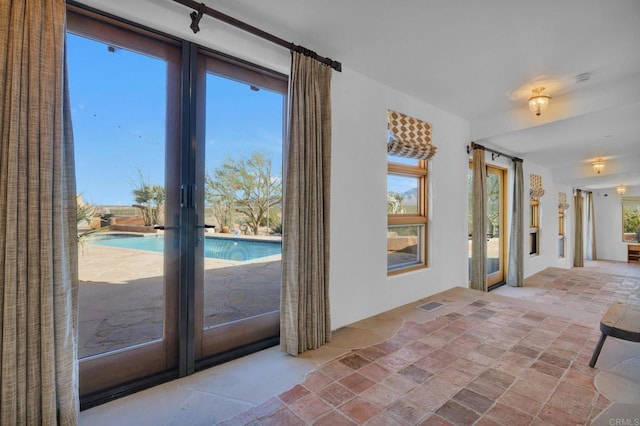 entryway featuring plenty of natural light and french doors