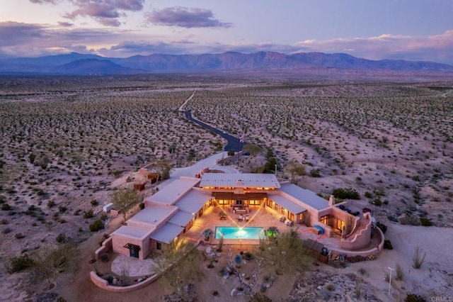 aerial view at dusk with a mountain view