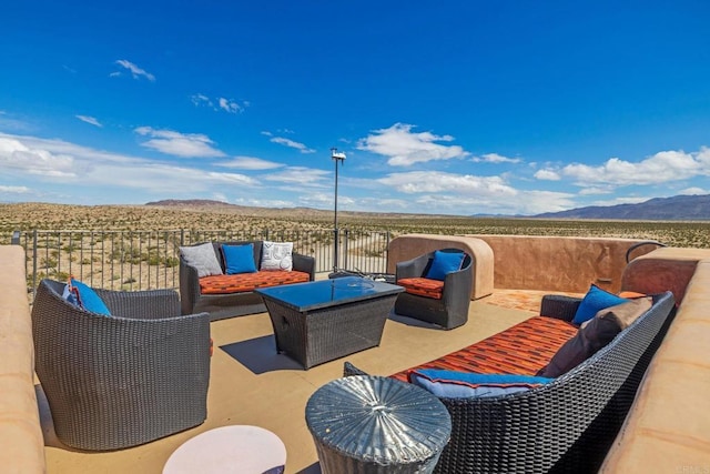 view of patio featuring a mountain view and an outdoor hangout area