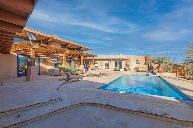 view of pool with a pergola and a patio area