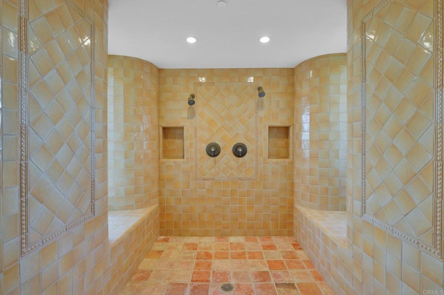 bathroom with tiled shower