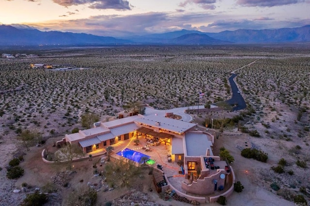 aerial view at dusk with a mountain view