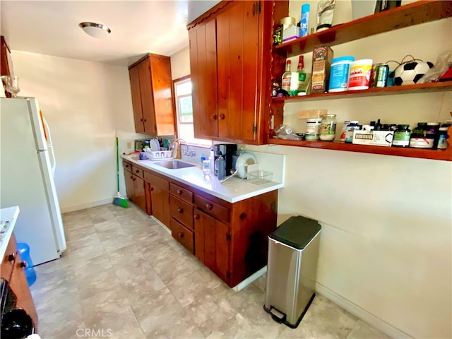 kitchen with white refrigerator and sink