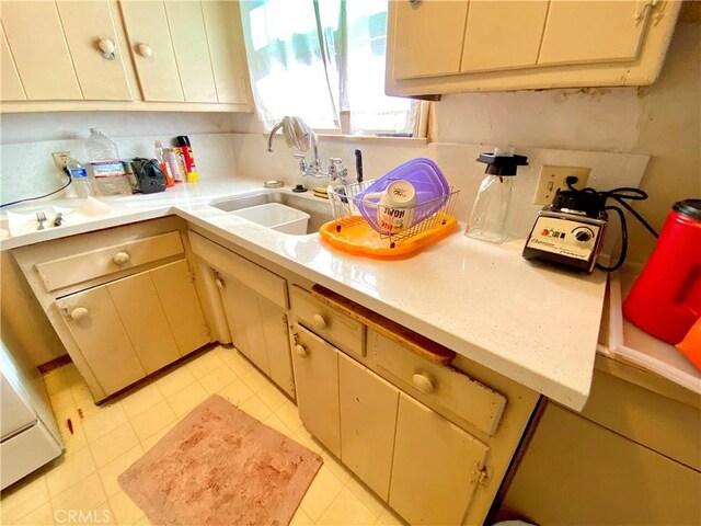 1201 W Verdugo Ave, Burbank, CA 91506 - kitchen with light countertops, light tile patterned flooring, and a sink