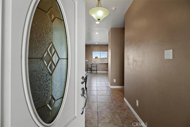 corridor with light tile patterned floors