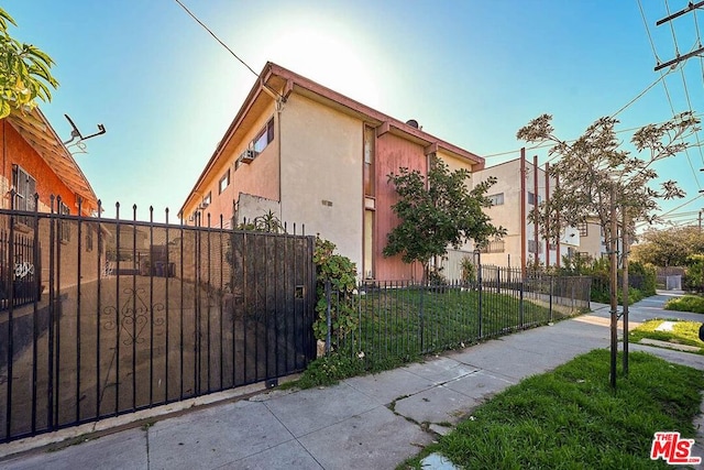 view of side of home with a lawn