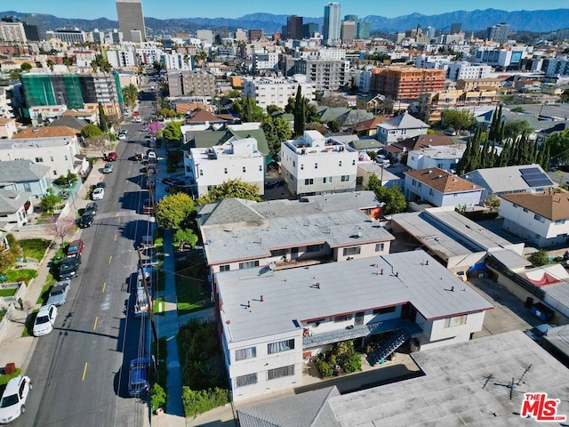 birds eye view of property with a mountain view