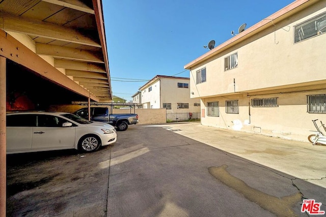 view of parking with a carport