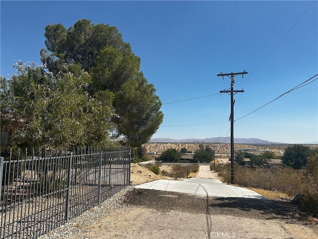 view of gate with a mountain view