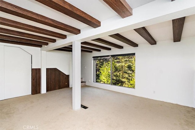 basement featuring light carpet