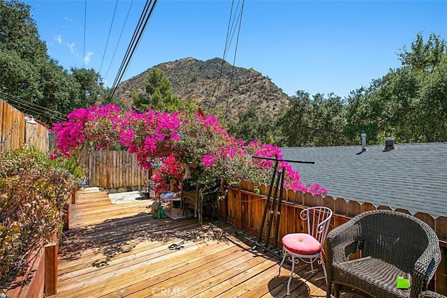 wooden terrace with a mountain view