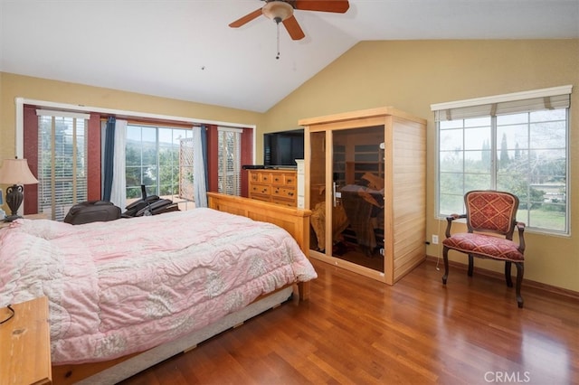 bedroom with vaulted ceiling, hardwood / wood-style floors, and ceiling fan