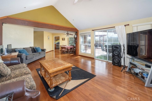 living room featuring high vaulted ceiling, ceiling fan, and hardwood / wood-style floors