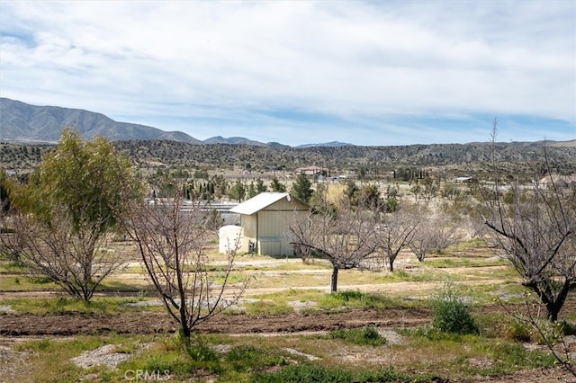 view of mountain feature with a rural view