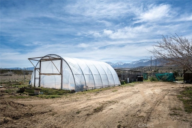 view of outbuilding with a mountain view