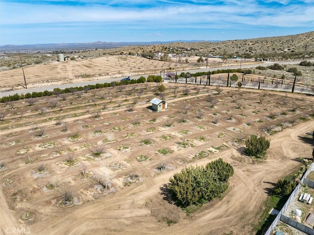 birds eye view of property featuring a rural view