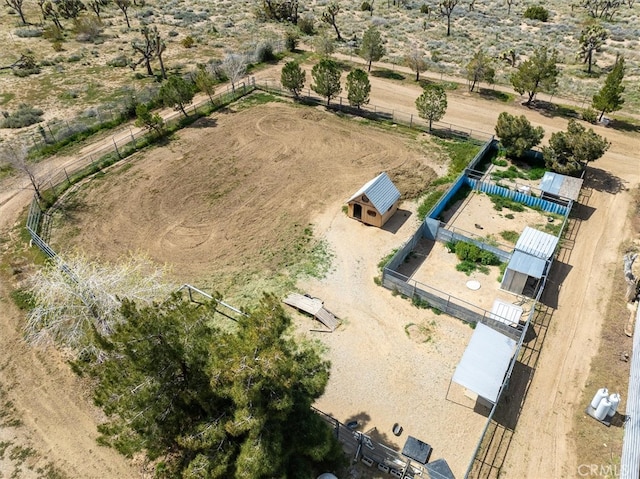 birds eye view of property with a rural view