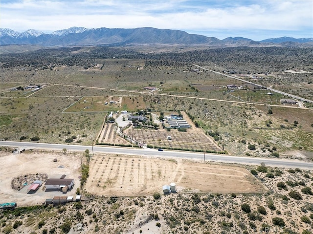 drone / aerial view with a mountain view and a rural view