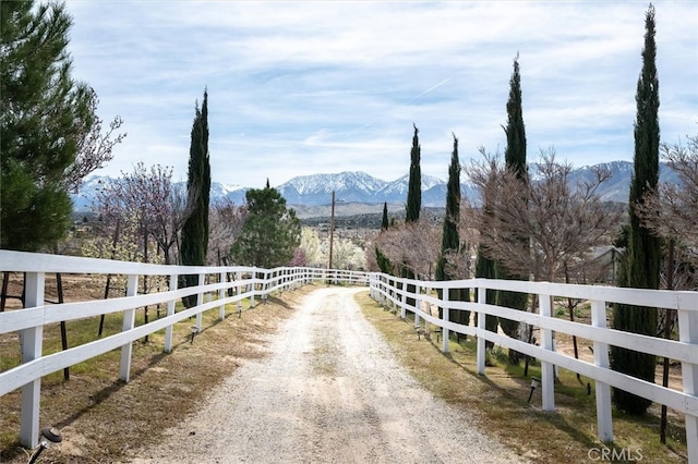 view of road with a mountain view and a rural view