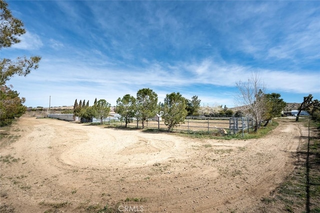 view of yard with a rural view