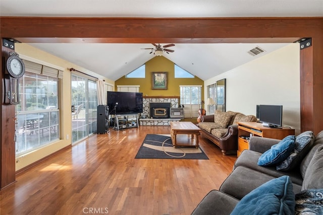 living room with ceiling fan, light hardwood / wood-style floors, and a wealth of natural light